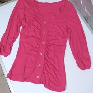 Pink elbow length shirt.